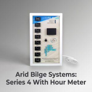 Close-up of an Arid Bilge Systems control panel with zones 1–8 and a white cable on the right, mounted in a white frame against a gray background.