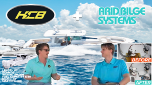 Two men discuss bilge vacuum system aboard luxury center console yacht