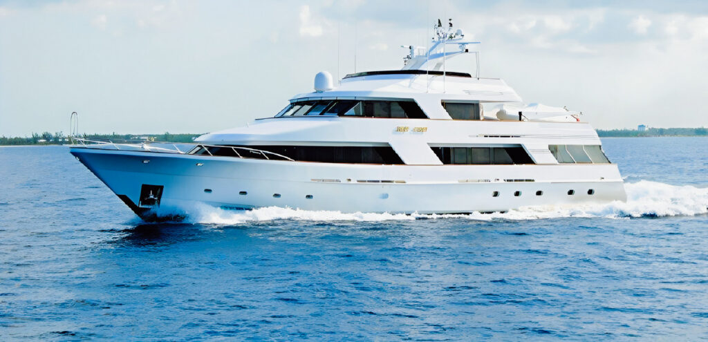 Reef Chief motor yacht underway on blue water.