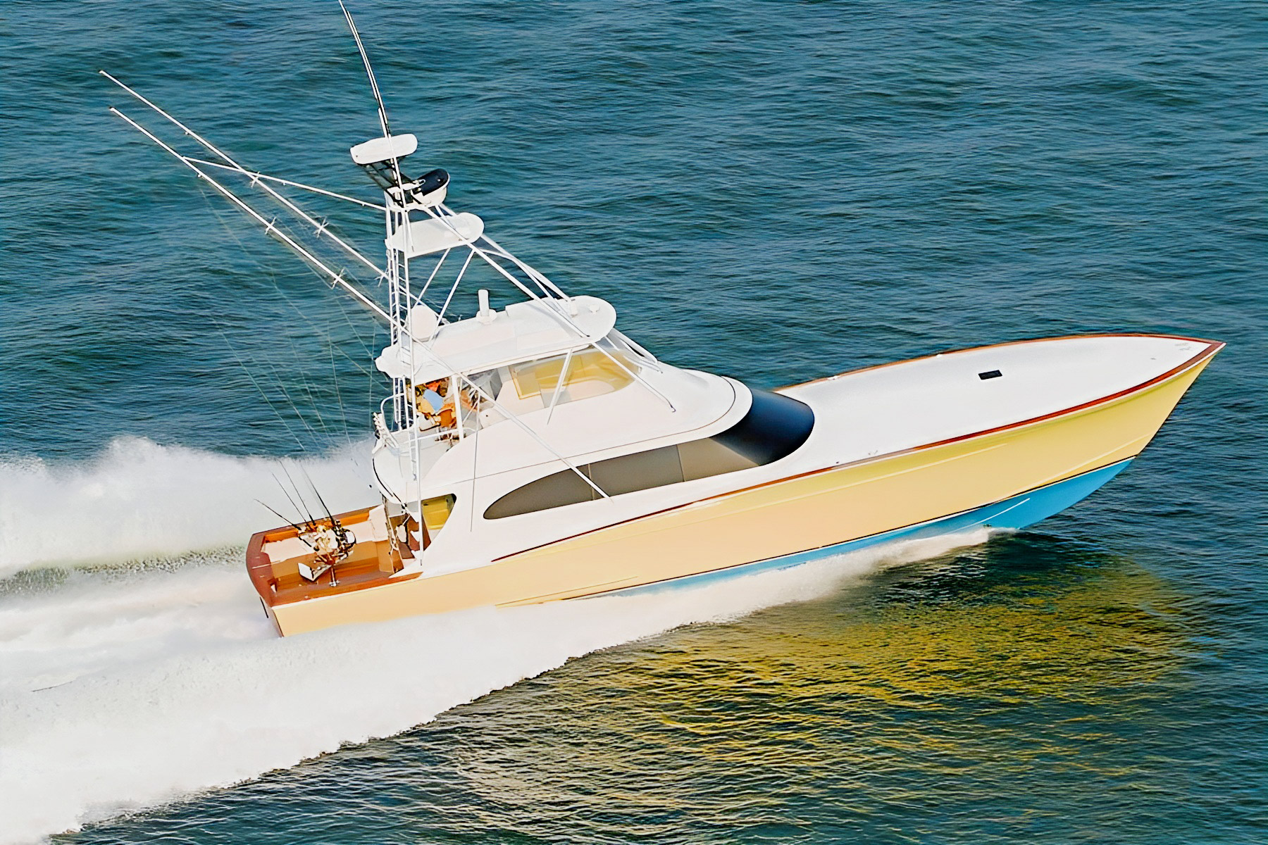 Gratitude, a yellow-hulled Spencer sportfishing yacht, underway.