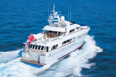 Cortina motor yacht underway, viewed from above and astern.
