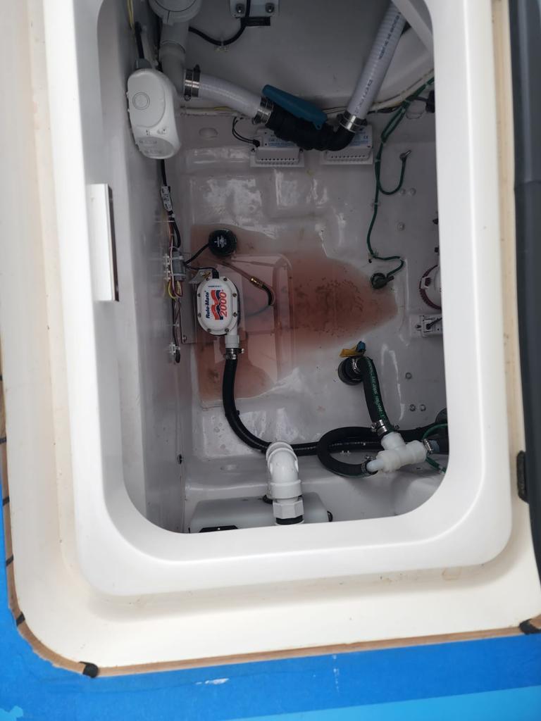 Archived before photograph: White bilge hatch compartment.