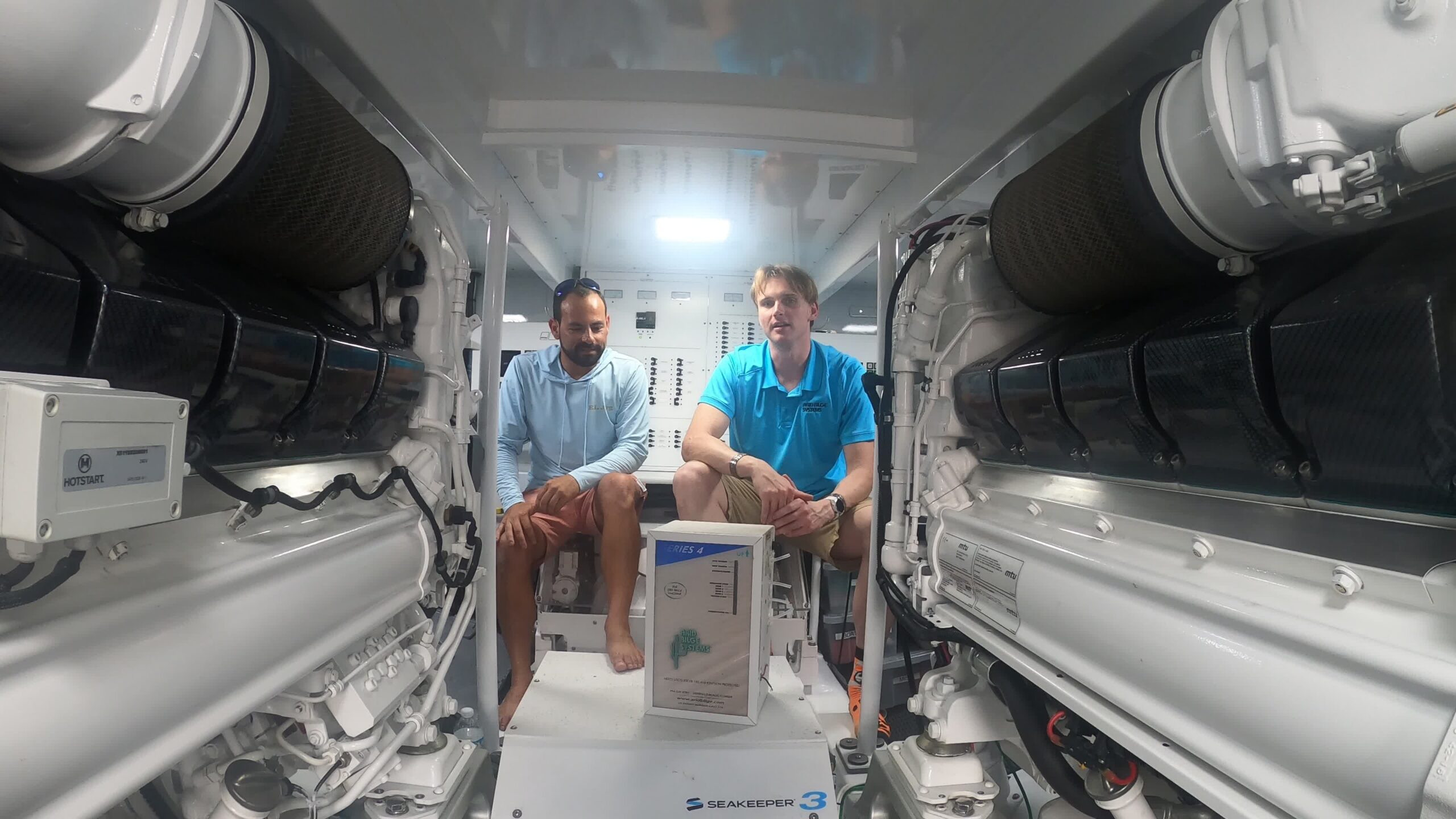 Capt. Brett and Alfred Baurley with an Arid Series 4 unit between the engines aboard El Jefe.