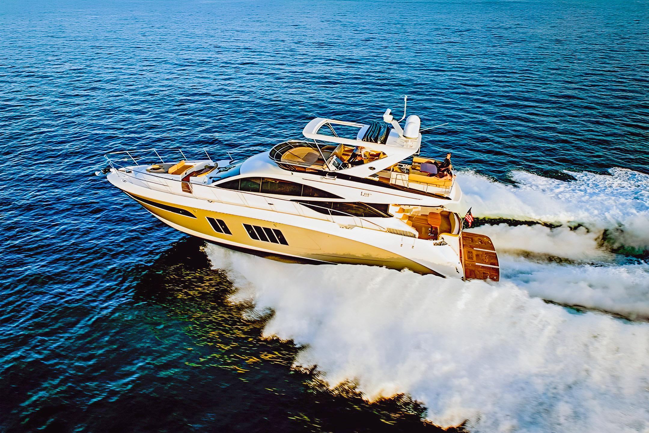 Flawless, a Sea Ray L650 Fly motor yacht, underway in an overhead view.