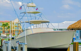 Longer Hours, a 36-foot Gillikin sportfish with a tall tower, on a boat lift.