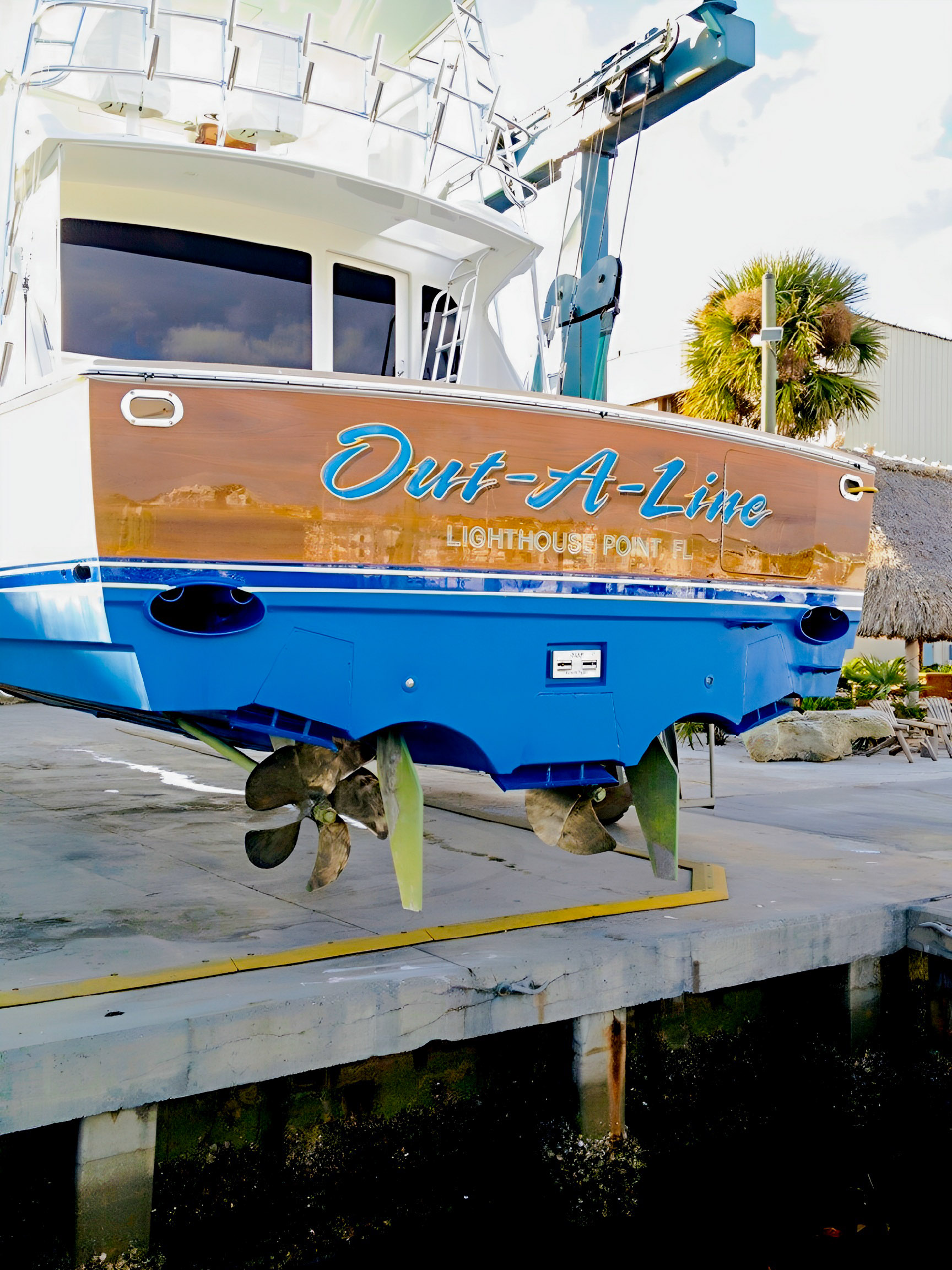 Out-A-Line’s named stern, propellers and hull while the yacht is ashore.
