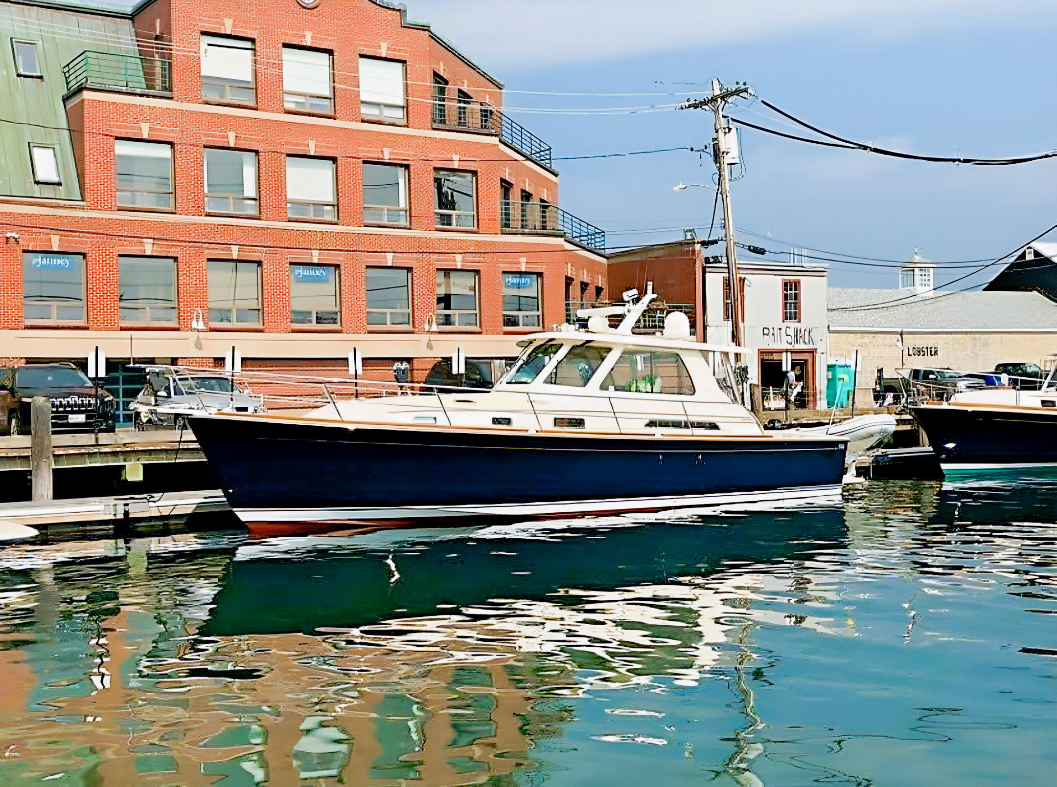 Blue-hulled Sabre 38 Equinox alongside a waterfront dock